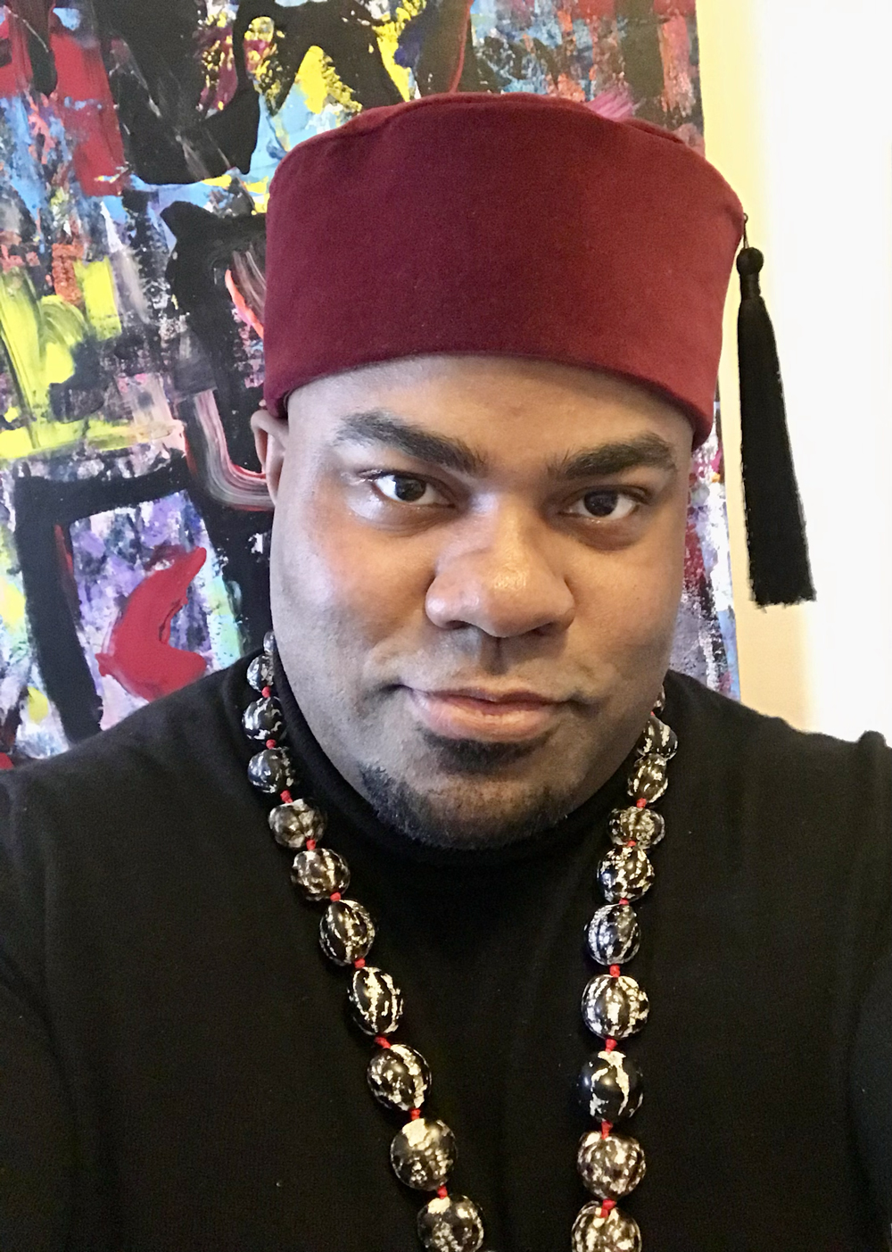 Headshot of a smiling man