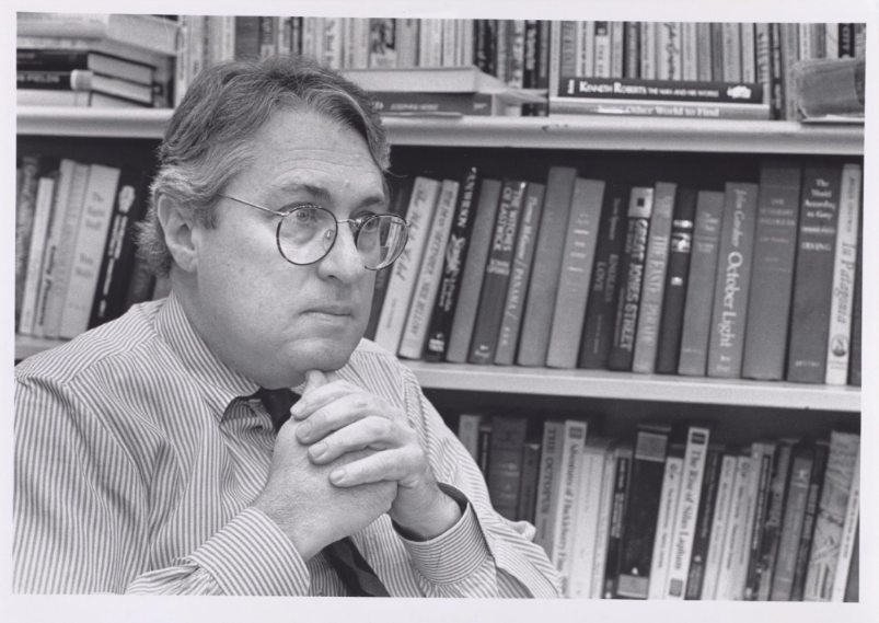 Olmert in 1991 sitting in front of bookshelf