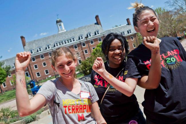 three students laughing